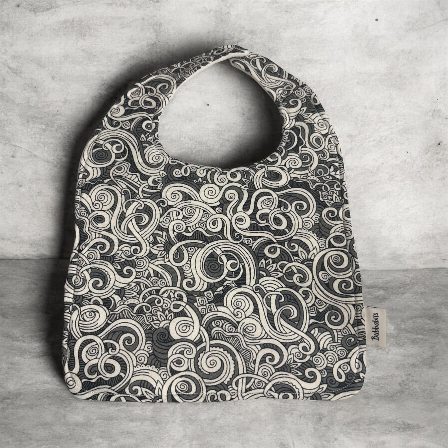 Feeder Bib - Māori inspired Koru grey